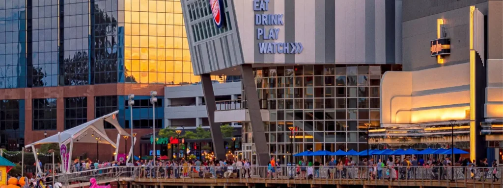 a Row of 28 Self serve Beer Taps is Mounted on a Black Wall in This Frederick Movie Theatre Each with a Digital Display Above Large Signs Promote Gift Cards and the Self serve Feature with a Glass of Beer Shown on the Signs