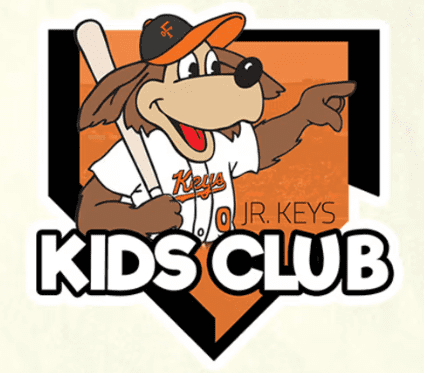 a Cartoon Dog Mascot in a Baseball Uniform and Orange Cap Holds a Bat and Points Forward the Text Reads Jr Keys Kids Club Orange Black and White Pop Against a Home Plate Backgroundperfect for Young Fans Checking the Frederick Keys Schedule
