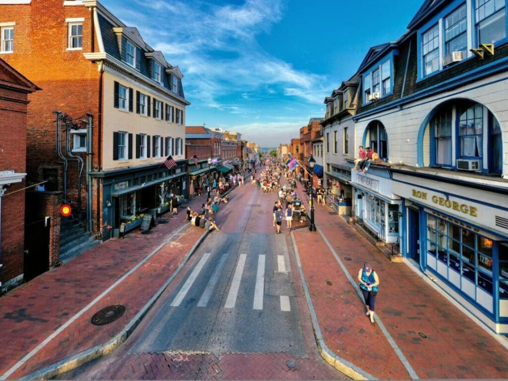 a Lively Pedestrian Only Street in Annapolis Maryland Lined with Historic Brick and Colorful Buildings Discover Shops Restaurants and Plenty of Things to Do As People Enjoy Outdoor Tables and Stroll in a Vibrant Welcoming Atmosphere